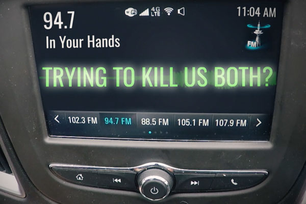 a car's digital panel that reads are you trying to kill us both
