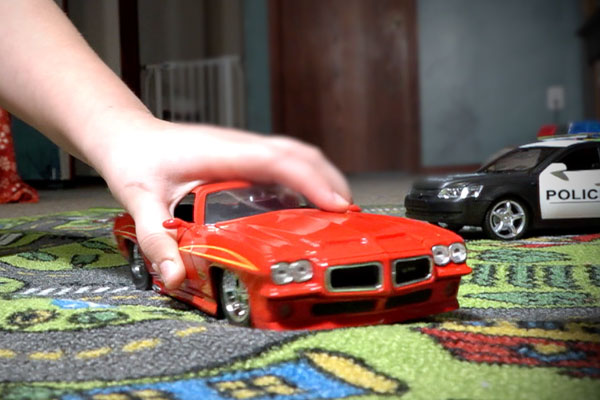 playing with a toy car