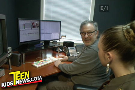 a production team in front of a monitor