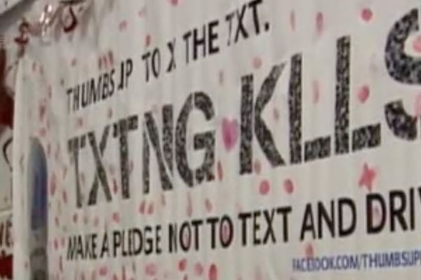 a mural with texting kills and signatures and thumb-prints