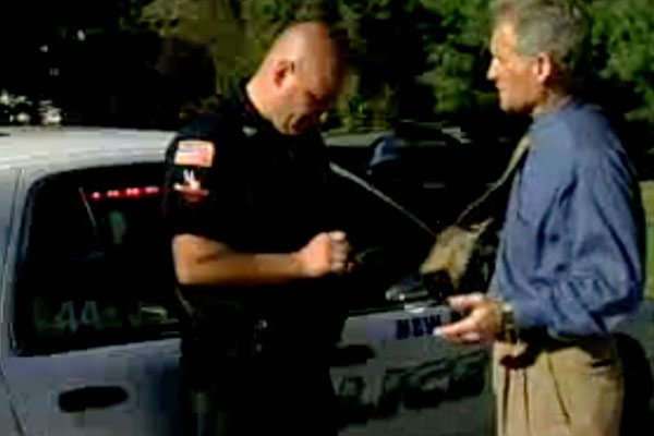 police officer taking a statement from a man