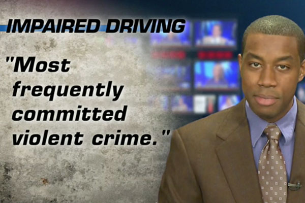 An anchor man with a chyron about impaired driving